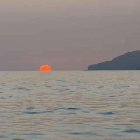 The sun going down over the sea off Funchal