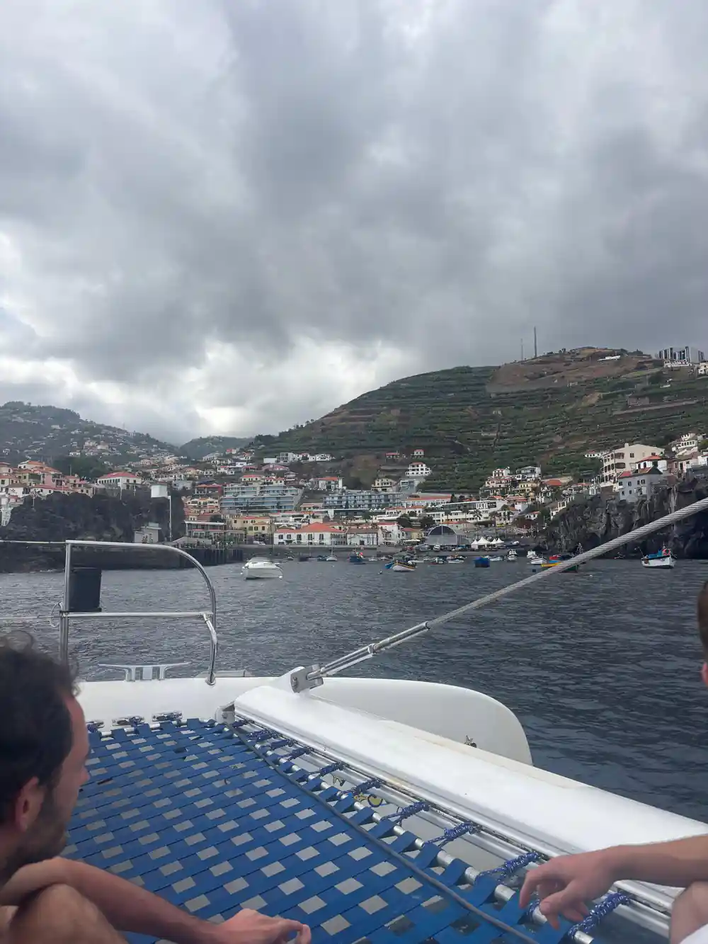 The deck and nets with a coastal village behind