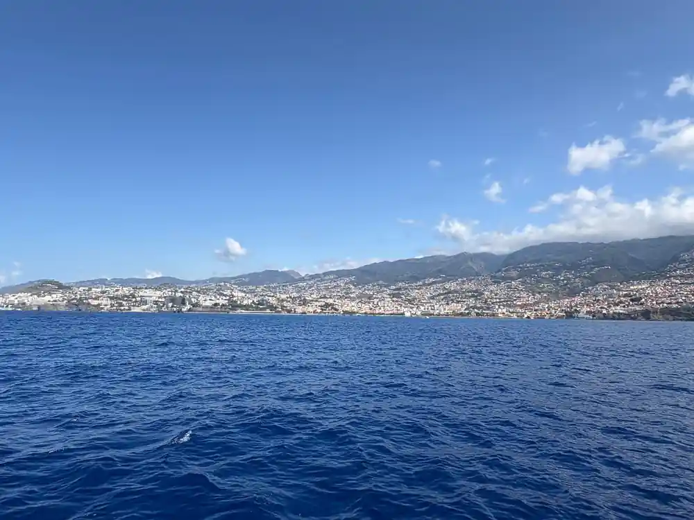 Funchal spread along the shoreline seen from open water